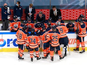 Head coach Ken Holland of the Edmonton Oilers talks to his players late in the third period against the Chicago Blackhawks during Game 1 of the Western Conference Qualification Round prior to the 2020 NHL Stanley Cup Playoffs at Rogers Place on Aug. 1, 2020.