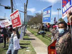 President Donald Trump and Vice-President Joe Biden supporters during a rally on West Gray Street on Nov. 3, 2020 in Houston, Texas.