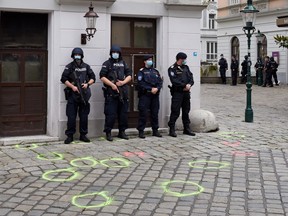 Police guard the crime scene after a wreath laying ceremony by the Austrian government in the city centre the day after a deadly shooting spree on Nov. 3, 2020 in Vienna, Germany.