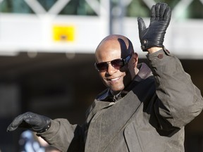 Double football Hall-of-Famer Warren Moon takes part in the Grey Cup Parade along 102 Avenue in Edmonton on Nov. 27, 2010.