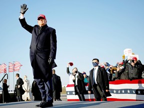 U.S. President Donald Trump waves during a campaign rally at Dubuque Regional Airport in Iowa, U.S., November 1, 2020.