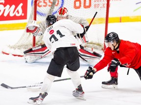 Team Canada White forward Connor Zary takes a shot in a scrimmage at the Westerner Park Centrium in Red Deer on Sunday, Nov. 22, 2020.