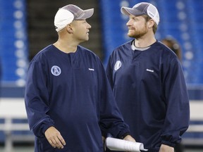 Coaches Scott Milanovich, left, and Mike O'Shea run Toronto Argonauts practice at Rogers Centre on Nov. 15, 2012, in preparation for the East Division semi-final in Montreal.