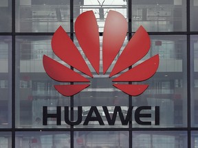 In this file photo taken April 29, 2019, the Huawei logo and signage is seen at their main U.K. offices in Reading, west of London.