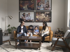 Proceso Jr and Claudette Flordeliz, with their children Jacob, 7, and Cassie, 3, in their new home by Homes by Avi in Rosenthal.