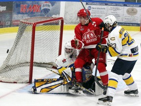 Pembroke Lumber Kings captain Jordan Shankar and Carleton Place Canadians' goalie Devon Levi look on as the pick goes wide of the Carleton Place net during CCHL action at the PMC Sept. 29, 2019.