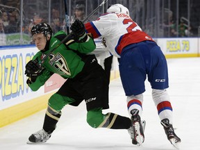 Fellow Sherwood Park product Matthew Robertson of the Edmonton Oil Kings checks Prince Albert Raiders' Kaiden Guhle during the WHL’s Eastern Conference championship in April of 2019.