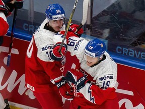 Martin Lang (10) and Jan Mysak (19) of the Czech Republic celebrate Mysak's goal against Sweden during the 2021 IIHF world junior championship at Rogers Place on Dec. 26, 2020.