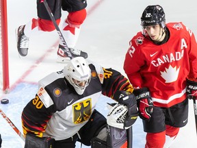 Team Canada's Dylan Cozens (22) celebrates his goal against goaltender Jonas Gahr (30) of Germany during the 2021 IIHF world junior championship at Rogers Place on Dec. 26, 2020.