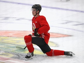 Kirby Dach of the Chicago Blackhawks stretches after a summer training camp practice at Fifth Third Arena on July 14, 2020 in Chicago, Illinois.