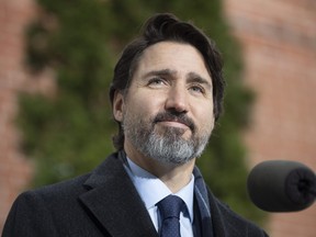 Prime Minister Justin Trudeau listens to a question from a reporter during a bi-weekly news conference outside Rideau cottage in Ottawa, Friday, Nov. 27, 2020.