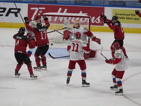 Canada celebrates a goal scored by Jamie Drysdale (6) (not pictured) against  Russia during third period IIHF World Junior Hockey Championship pre-competition action on Wednesday, Dec. 23, 2020 in Edmonton.