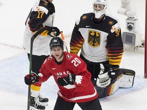 Canada's Dawson Mercer (20) celebrates a goal scored on Germany's goalie  Jonas Gahr (30) during second period IIHF World Junior Hockey Championship action on Saturday, Dec. 26, 2020 in Edmonton.
