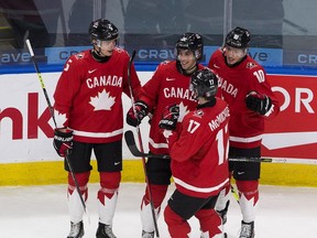 Canada's Dylan Cozens (22) celebrates his goal with teammates against Finland during first period IIHF World Junior Hockey Championship action on Thursday, Dec. 31, 2020 in Edmonton.