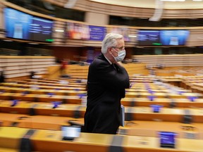 EU chief Brexit negotiator Michel Barnier leaves the Hemicycle during a debate on future relations between Britain and the EU in a plenary session at the European Parliament in Brussels, Belgium December 18, 2020.