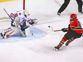 Calgary Hitmen forward Kaden Elder scores on Kamloops Blazers goaltender Dylan Garand faces Calgary Hitmen forward Kaden Elder at the Scotibank Saddledome in this file photo from Dec. 9, 2018.