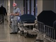 ICU nurse Sophie Gabiniewicz takes a moment to herself to write some notes during her shift at St. Paul’s Hospital in downtown Vancouver, Friday, Dec. 4, 2020.