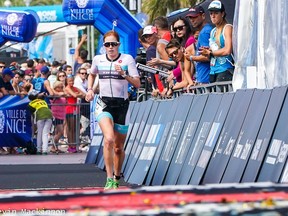 Paula Findlay of Edmonton crosses the finish line in this file photo from  Ironman 70.3 Indian Wells La Quinta on Saturday Dec. 14, 2019.