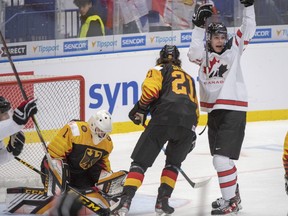 Canada's Raphael Lavoie reacts after the third goal as Germany's goaltender Hendrik Hane and Moritz Seider (21) look on during second period action at the World Junior Hockey Championships on Monday, December 30, 2019 in Ostrava, Czech Republic.