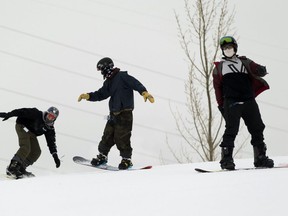 Snowboarders at Sunridge ski hill on Tuesday, Dec. 22, 2020 in Edmonton.