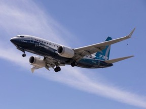 A Boeing 737 MAX airplane lands after a test flight at Boeing Field in Seattle, June 29, 2020.