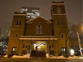 Patrons walk into the McDougall United Church during the Christmas by candlelight service in 2013.