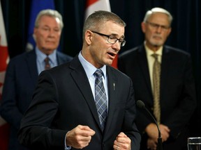 Finance Minister Travis Toews speaks during a press conference at the Alberta legislature on Dec. 18, 2019.