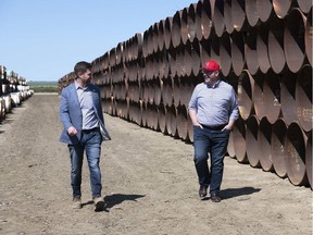 Premier Jason Kenney, right, expressed concern that the scrapping of Keystone XL could impact other cross-border pipeline projects on Monday.