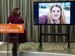 NDP MLAs Sarah Hoffman and Janis Irwin listen as Lia Lousier speaks out against vacationing UCP MLAs, who's family had to cancel a Make A Wish trip to Hawaii for her son Braeden, during a press conference in Edmonton, on Monday, Jan. 4, 2021. Photo by Ian Kucerak
