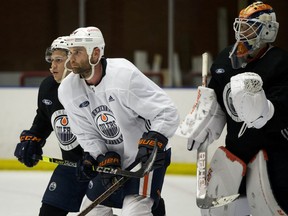 Caleb Jones, left, Zack Kassian, middle, and goaltender Anton Forsberg take part in Day 2 of the Edmonton Oilers 2020-2021 training camp at the The Northern Alberta Institute of Technology (NAIT), in Edmonton Monday Dec. 30, 2021.