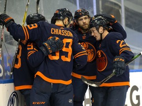 The Edmonton Oilers celebrate their first goal against the Vancouver Canucks in Edmonton on Thursday, Jan. 14, 2021.