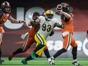 Edmonton Eskimos defensive end Kwaku Boateng (93) chases after B.C. Lions quarterback Mike Reilly in Vancouver in this file photo from July 11, 2019.