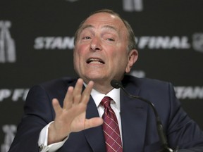 In this May 27, 2019, file photo, NHL commissioner Gary Bettman speaks to the media before Game 1 of the NHL hockey Stanley Cup Finals between the St. Louis Blues and the Boston Bruins, in Boston.