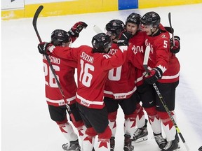 Canada celebrates a goal against Russia during second period IIHF World Junior Hockey Championship semifinal action on Monday, Jan. 4, 2021 in Edmonton.