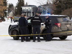 Police investigate the scene where a man was rushed to hospital in life-threatening condition after a shooting in west Edmonton on Sunday, Jan. 17, 2021 in Edmonton. Police were called to a home near 105 Avenue and 157 Street around 6:15 a.m.