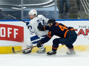 Edmonton Oilers forward Zack Kassian (44) battles Toronto Maple Leafs defenceman Morgan Reilly (44) during first period NHL action at Rogers Place in Edmonton, on Thursday, Jan. 28, 2021.