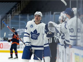 Toronto Maple Leafs' Auston Matthews (34) celebrates a goal on Edmonton Oilers' goaltender Mikko Koskinen (19) with teammates during third period NHL action at Rogers Place in Edmonton, on Thursday, Jan. 28, 2021.
