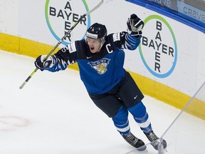 Finland's Anton Lundell (15) celebrates his empty-net goal after scoring on Russia in the IIHF world junior championship bronze-medal game on Tuesday, Jan. 5, 2021 in Edmonton.