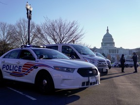 Police vehicles are parked outside the U.S. Capitol in Washington, D.C., Jan. 7, 2021.