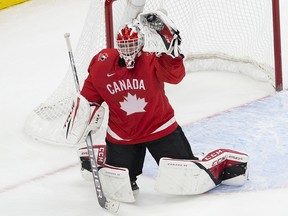 Canada's goalie Devon Levi (1) makes a save against Finland during the IIHF world junior championships on Dec. 31, 2020, in Edmonton.
