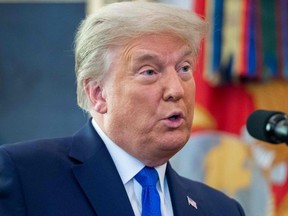 U.S. President Donald Trump speaks during a ceremony presenting the Presidential Medal of Freedom to wrestler Dan Gable in the Oval Office of the White House in Washington, D.C., Dec. 7, 2020.