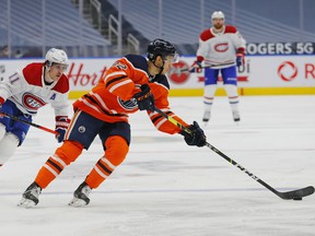 Edmonton Oilers defencemen Caleb Jones (82) is chased by Montreal Canadiens forward Brendan Gallagher (11) at Rogers Place on Jan 16, 2021.