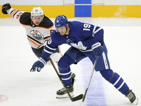 Toronto Maple Leafs forward Jason Spezza (19) skates past Edmonton Oilers forward Kailer Yamamoto (56) at Scotiabank Arena on Wednesday, Jan. 20, 2021.