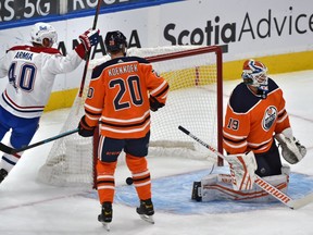 Montreal Canadiens Joel Armia (40) celebrates teammates Alexander Romanov (27) goal on Edmonton Oilers goalie Mikko Koskinen (19) during NHL action at Rogers Place in Edmonton, January 18, 2021.