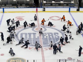 Players stretch during Edmonton Oilers training camp on Monday, Jan. 11, 2021, in Edmonton.
