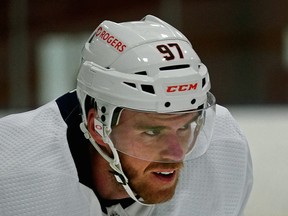 There is an increased amount of advertising around the Edmonton Oilers brand, as can be seen on the helmet of team captain Connor McDavid in training camp ahead of the 2021 NHL season, which opens Wednesday, Jan. 13, 2021.