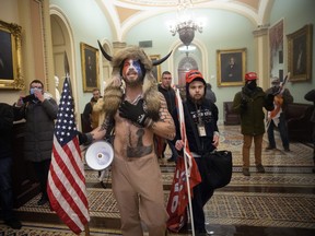 A pro-Trump mob confronts U.S. Capitol police outside the Senate chamber of the U.S. Capitol Building on January 06, 2021 in Washington, DC. (Photo by Win McNamee/Getty Images)