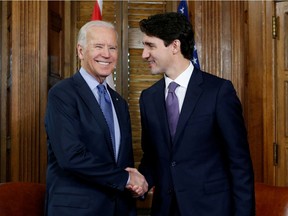 FILE PHOTO: Canada's Prime Minister Justin Trudeau (R) shakes hands with U.S. Vice President Joe Biden during a meeting in Trudeau's office on Parliament Hill in Ottawa, Ontario, Canada, December 9, 2016. REUTERS/Chris Wattie/File Photo ORG XMIT: FW1