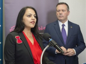 Rajan Sawhney, Alberta's Minister of Community and Social Services, and Premier Jason Kenney speak to the media in October 2019.