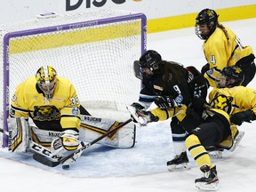 Lovisa Selander (35) of the Boston Pride makes a save on Autumn MacDougall (9) of the Buffalo Beauts during the Isobel Cup tournament at Herb Brooks Arena on Monday, Feb. 01, 2021, in Lake Placid, N.Y.